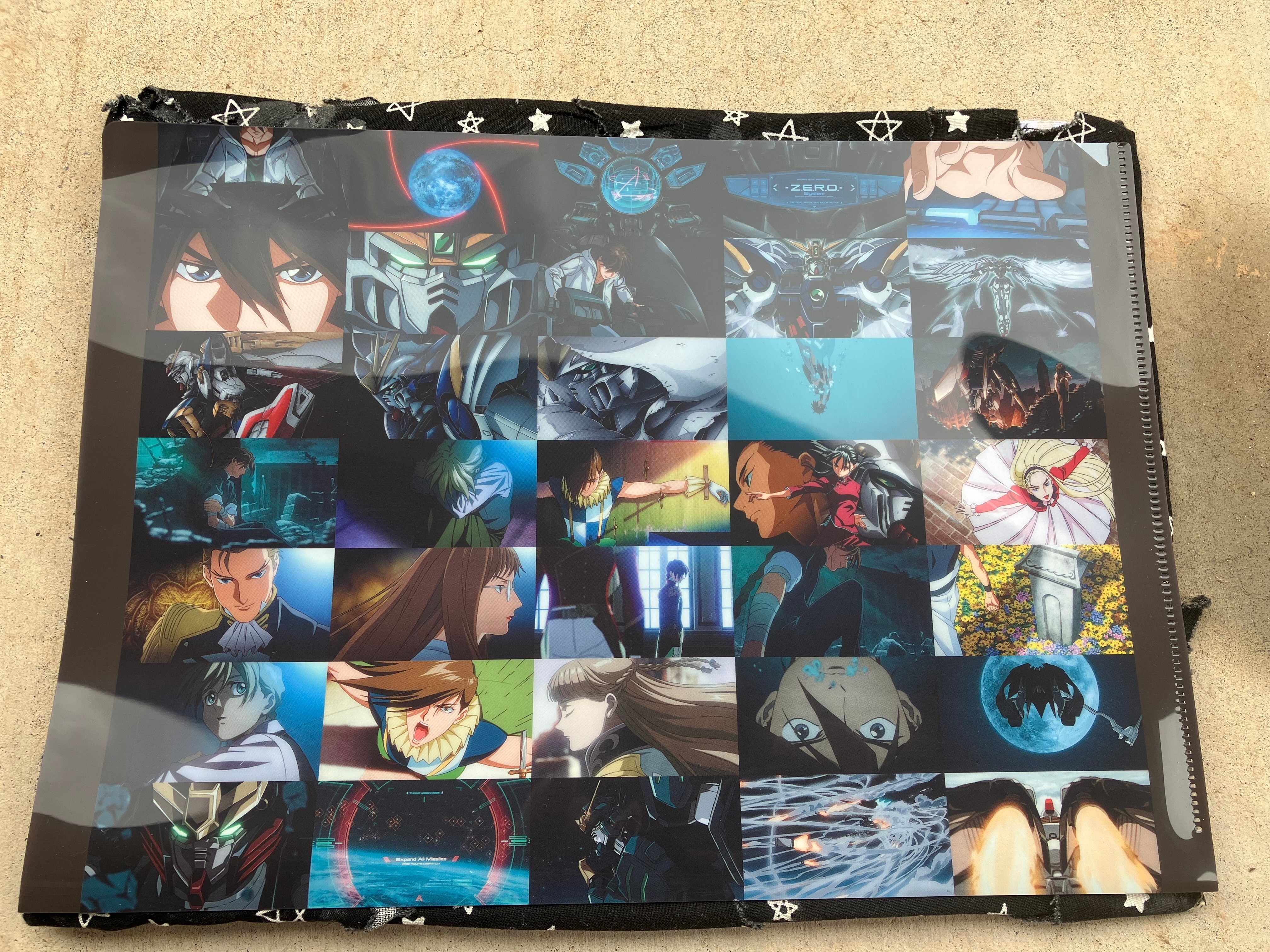 Front of clear file with various scenes of Gundam wing 30th anniversary animation.
